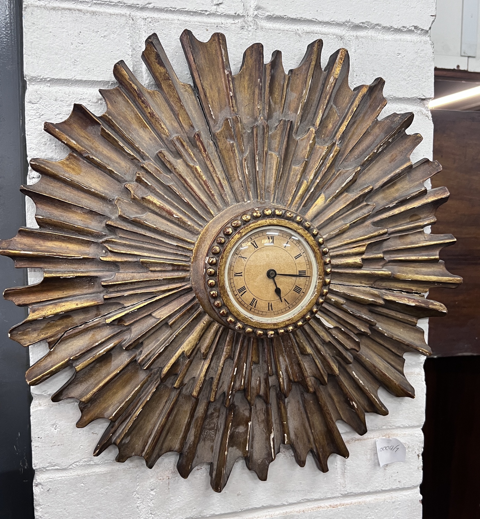 An early 20th century sunburst wall timepiece, diameter 50cm